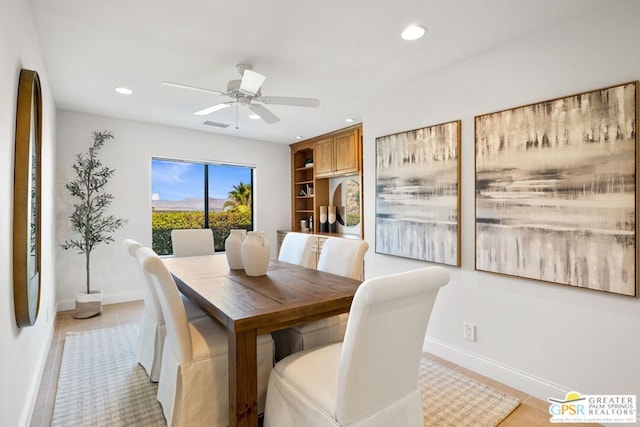 dining space featuring ceiling fan