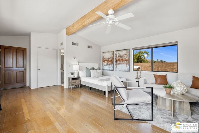 bedroom featuring ceiling fan, light hardwood / wood-style flooring, and lofted ceiling with beams