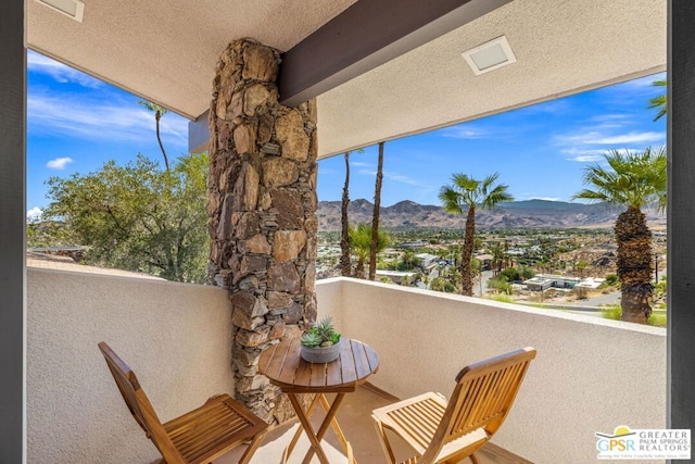 balcony featuring a mountain view