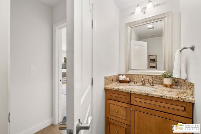 bathroom with vanity and tile patterned flooring