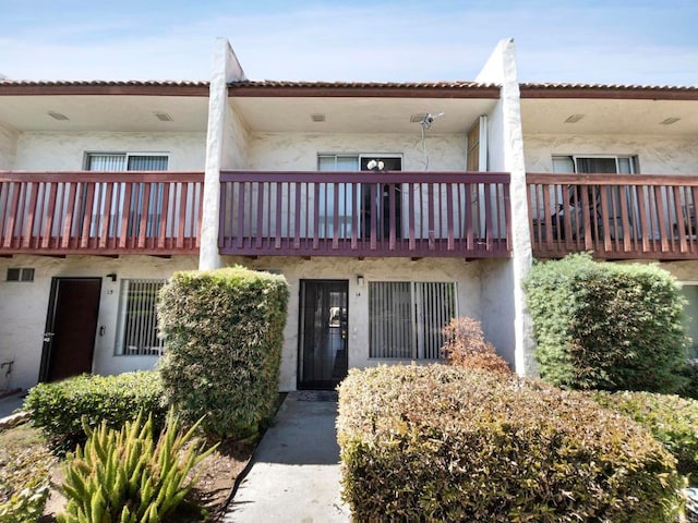 view of front of house featuring a balcony