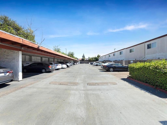 view of parking featuring a carport