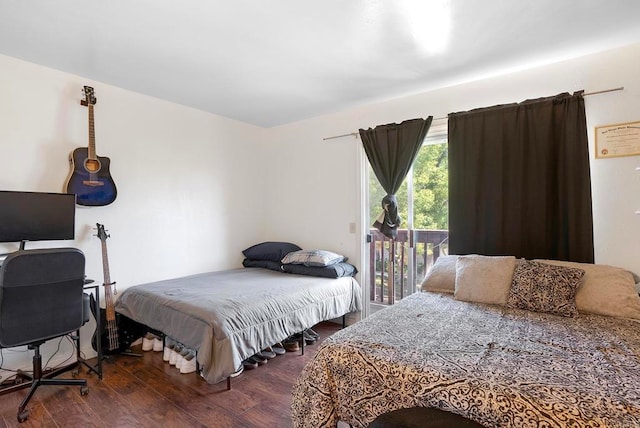 bedroom featuring access to outside and dark hardwood / wood-style floors