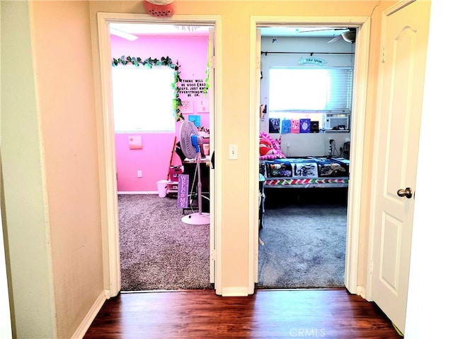 hall with dark wood-type flooring