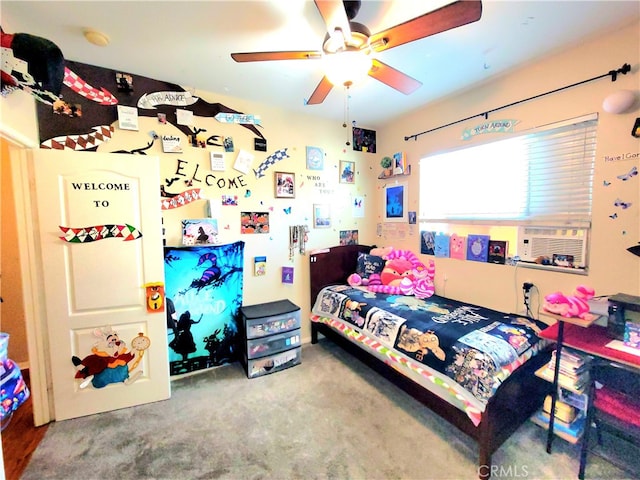 carpeted bedroom with cooling unit and ceiling fan