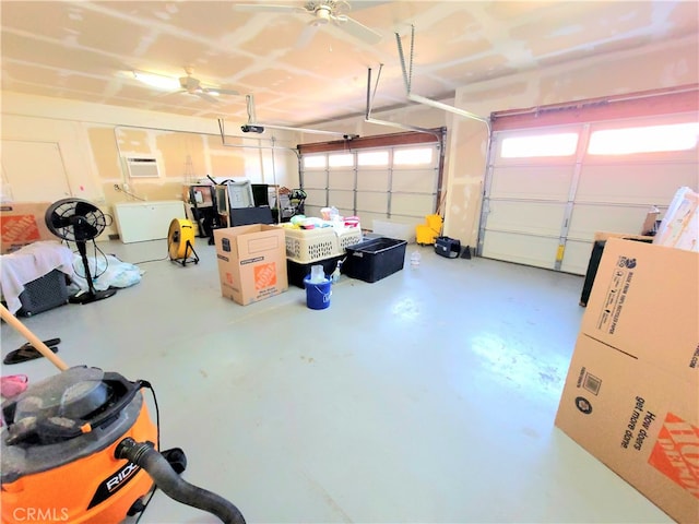 garage featuring ceiling fan and a garage door opener