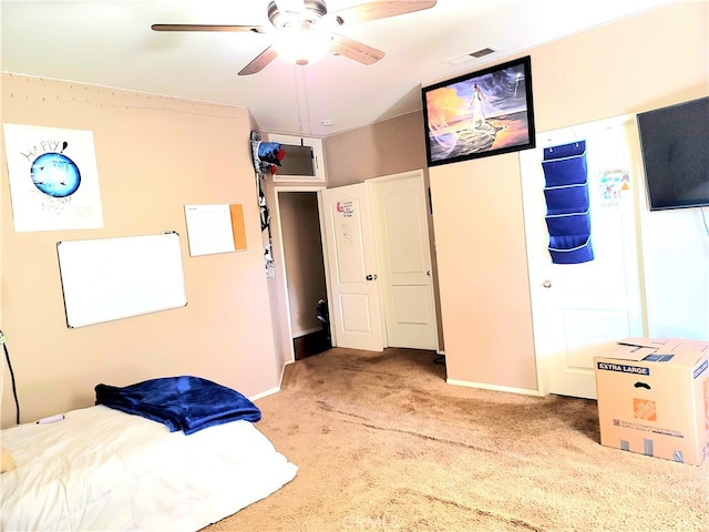 bedroom with ceiling fan and light colored carpet