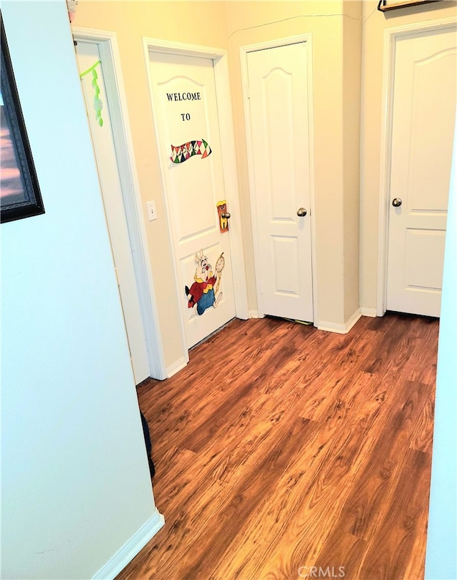 corridor featuring hardwood / wood-style flooring