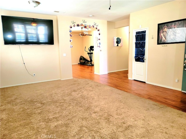 unfurnished room with hardwood / wood-style floors