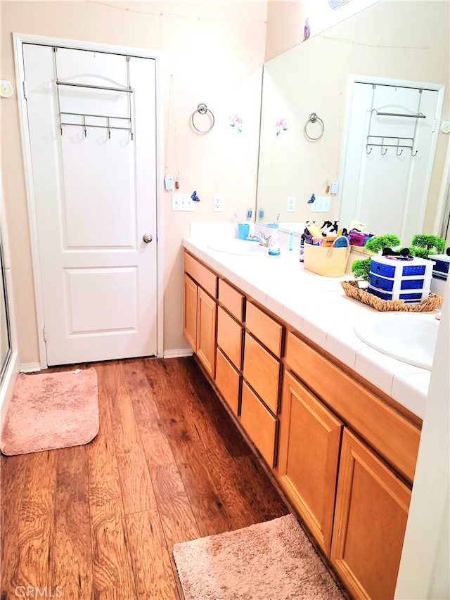 bathroom featuring hardwood / wood-style floors and vanity