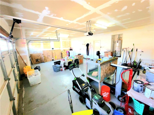 garage with a garage door opener and strapped water heater