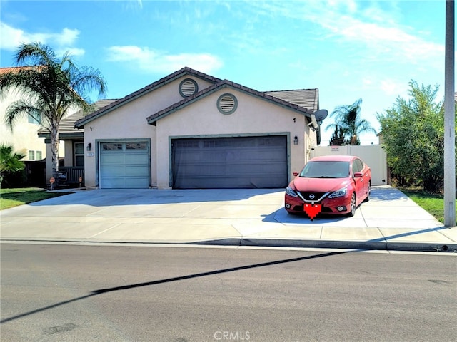 ranch-style home featuring a garage