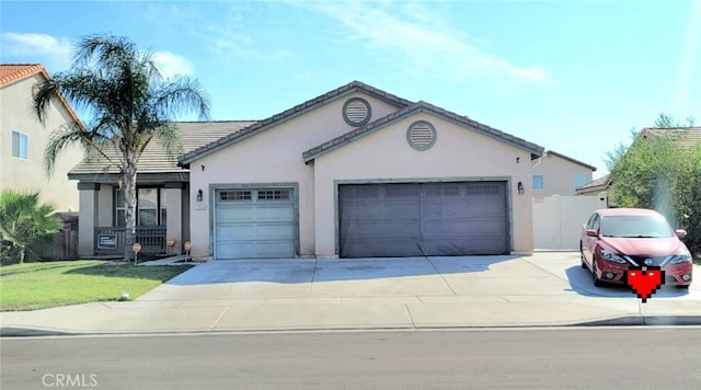 ranch-style home featuring a front lawn and a garage