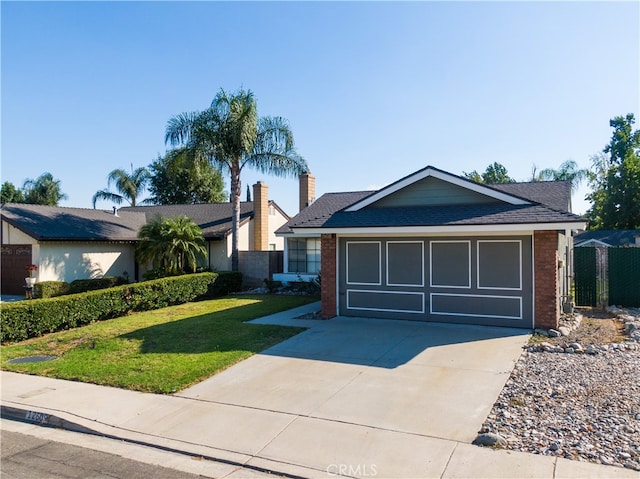 ranch-style home featuring a front yard and a garage