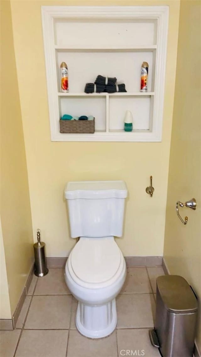 bathroom featuring tile patterned flooring and toilet