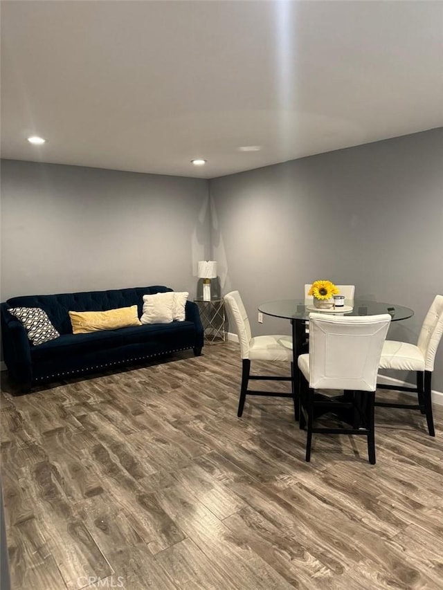 dining area with hardwood / wood-style flooring