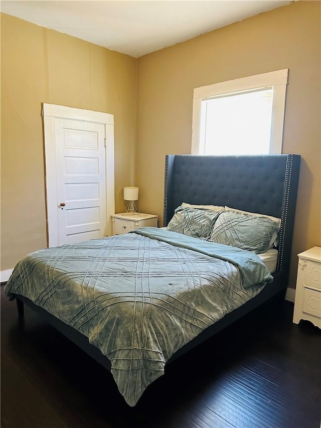 bedroom featuring dark wood-type flooring