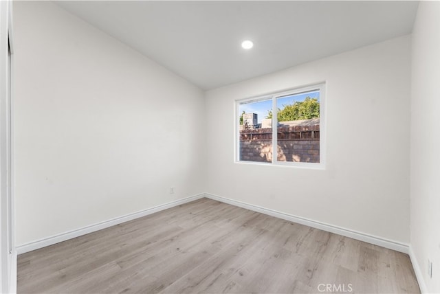 empty room with light hardwood / wood-style floors