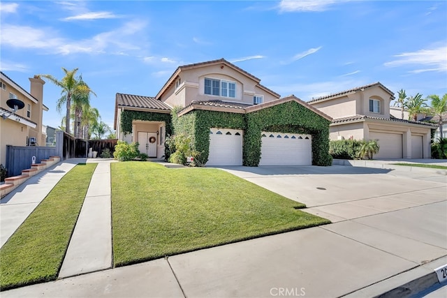 view of front of home featuring a front yard and a garage