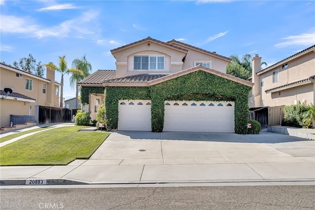 view of front property with a front yard and a garage