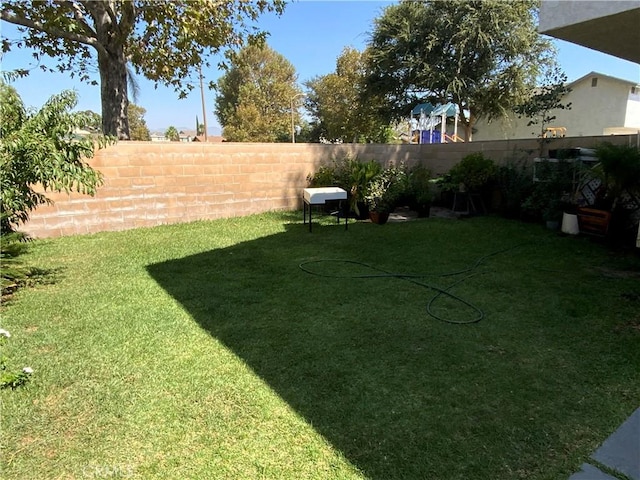 view of yard featuring fence