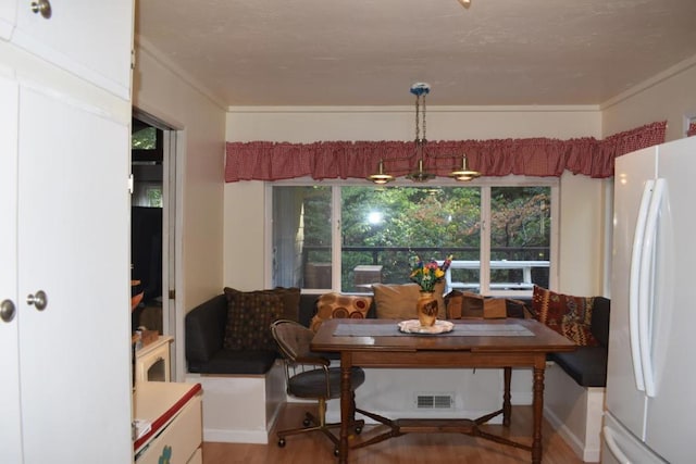 dining room featuring hardwood / wood-style flooring and breakfast area