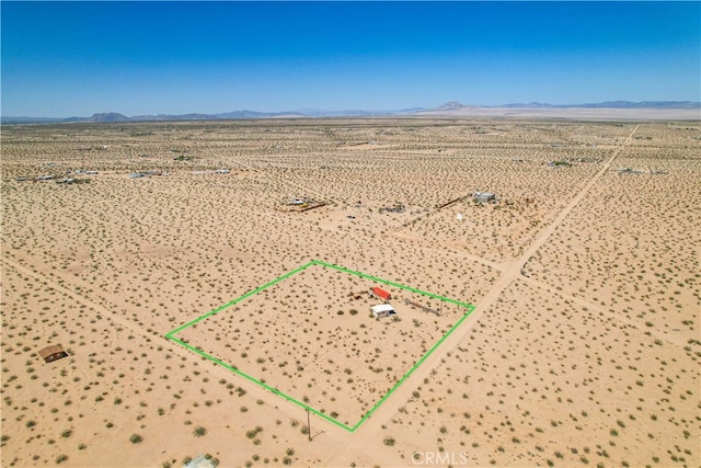 birds eye view of property featuring a mountain view