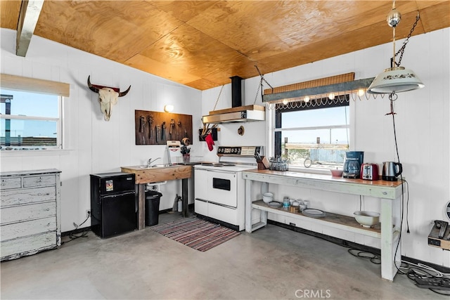 kitchen featuring concrete floors, decorative light fixtures, white electric stove, and range hood