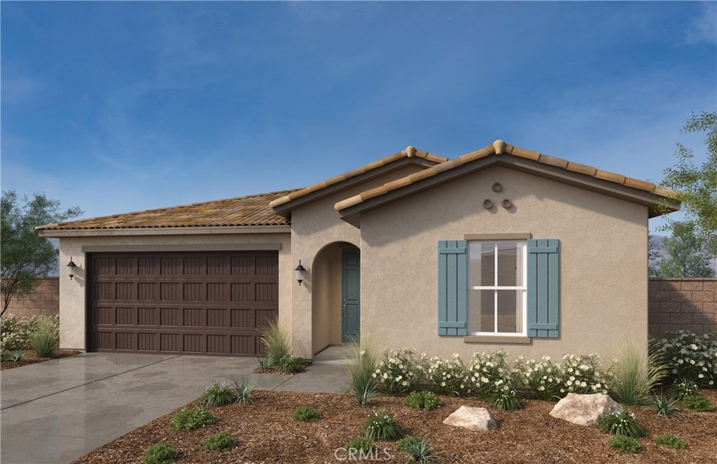 mediterranean / spanish-style house featuring a garage