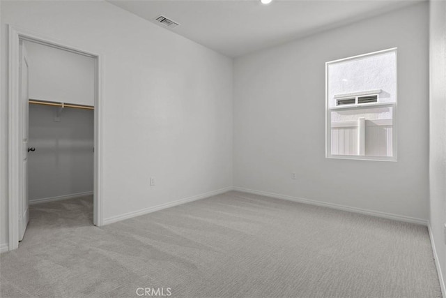 9665 Larimar Ct, Riverside, CA 92508 - unfurnished bedroom with a closet, visible vents, carpet floors, a walk in closet, and baseboards