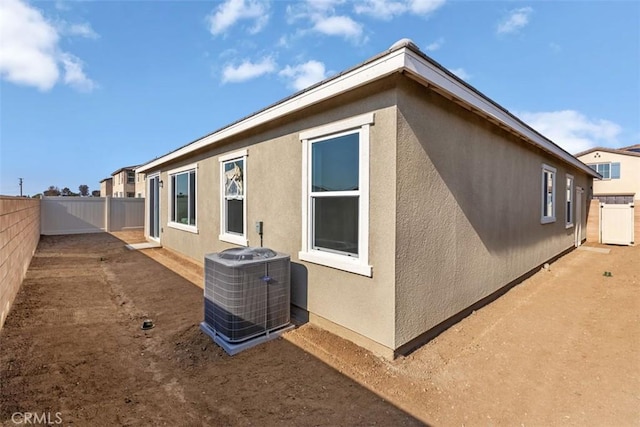 9665 Larimar Ct, Riverside, CA 92508 - exterior space with central AC unit, a fenced backyard, and stucco siding