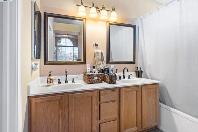 bathroom with shower / bath combination with curtain and vanity