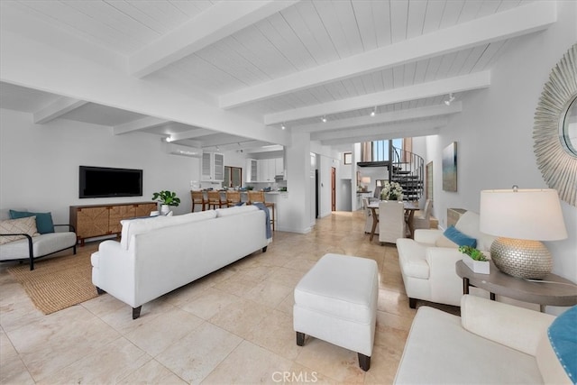 tiled living room with beamed ceiling