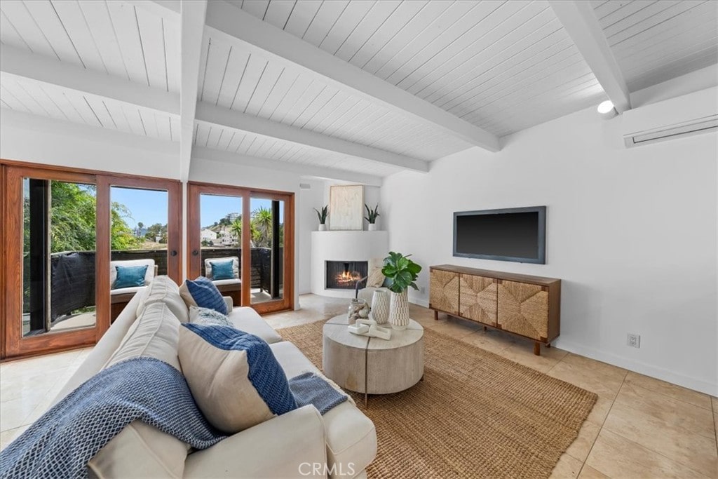 living room featuring wood ceiling, beam ceiling, a wall unit AC, and light tile patterned flooring