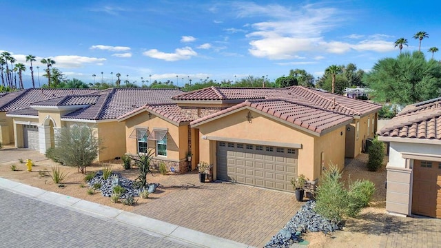 mediterranean / spanish-style house featuring a garage