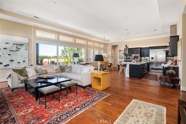 living room with dark wood-type flooring