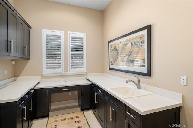 kitchen with light tile patterned flooring and sink