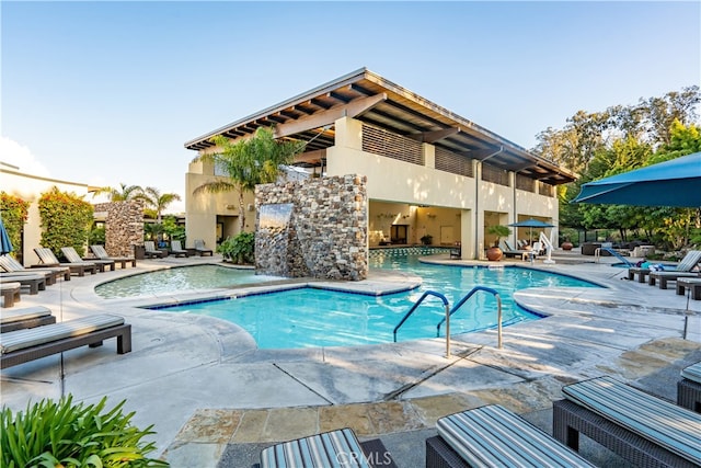 view of swimming pool featuring a patio area