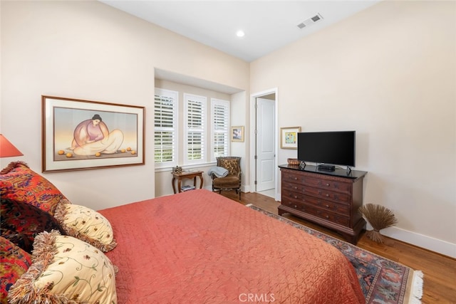 bedroom with wood-type flooring