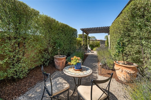 view of patio featuring a pergola