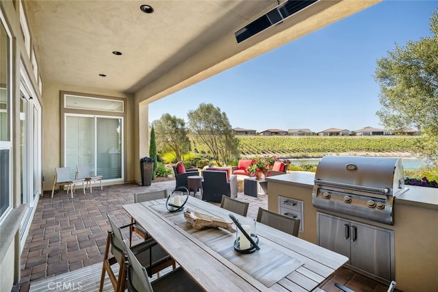 view of patio / terrace featuring a grill and exterior kitchen