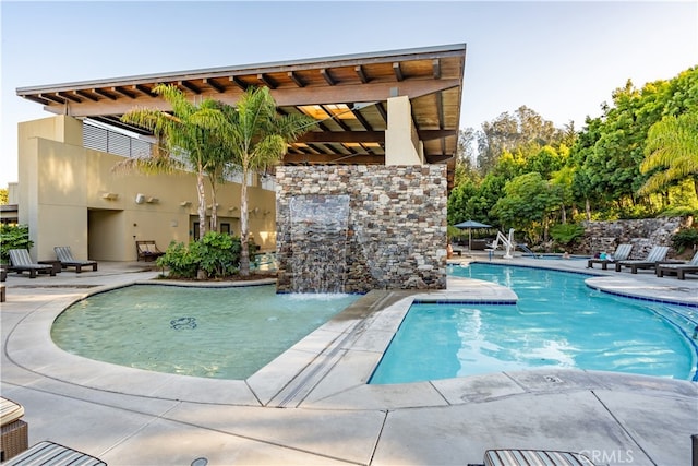 view of swimming pool with a patio area