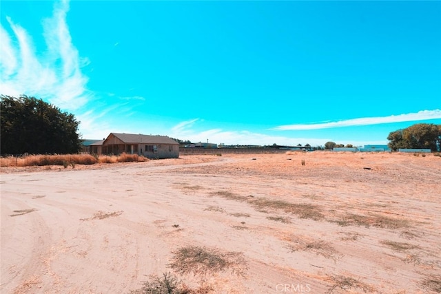 view of yard with a rural view