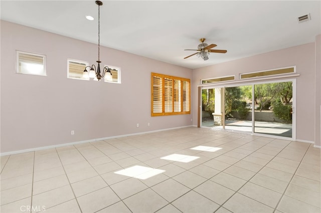 spare room with light tile patterned floors, baseboards, visible vents, and ceiling fan with notable chandelier