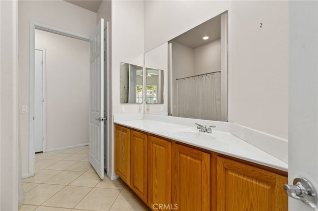 full bathroom featuring tile patterned floors, vanity, and a shower with curtain