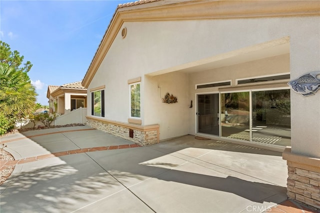 back of house with a patio