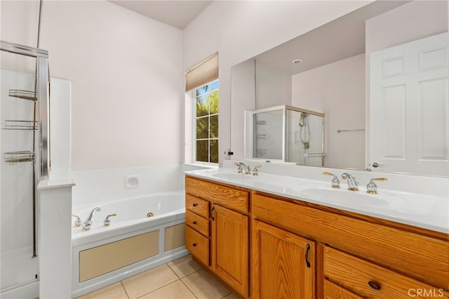 bathroom with a shower stall, a sink, tile patterned floors, a jetted tub, and double vanity