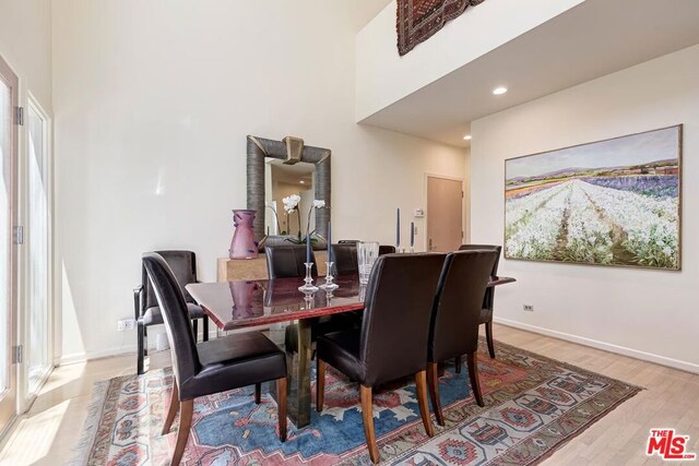 dining area with light hardwood / wood-style floors