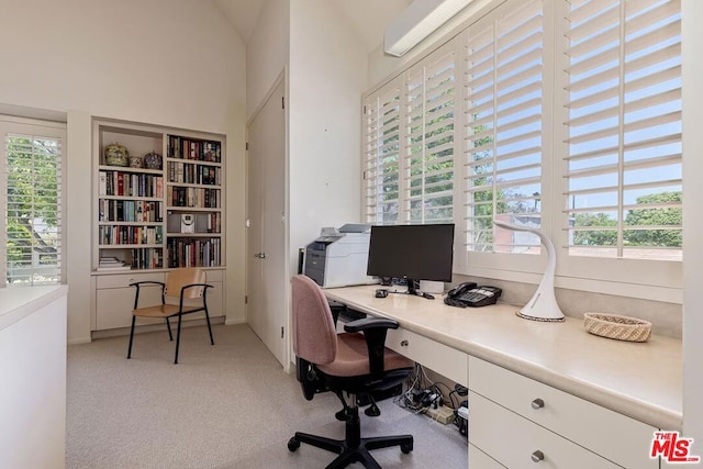 carpeted home office with plenty of natural light