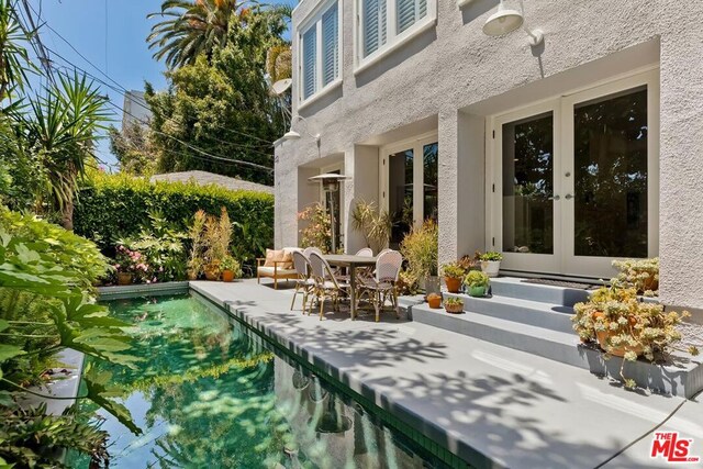 view of patio featuring french doors